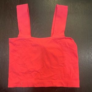 Hot pink cropped stretchy tank.